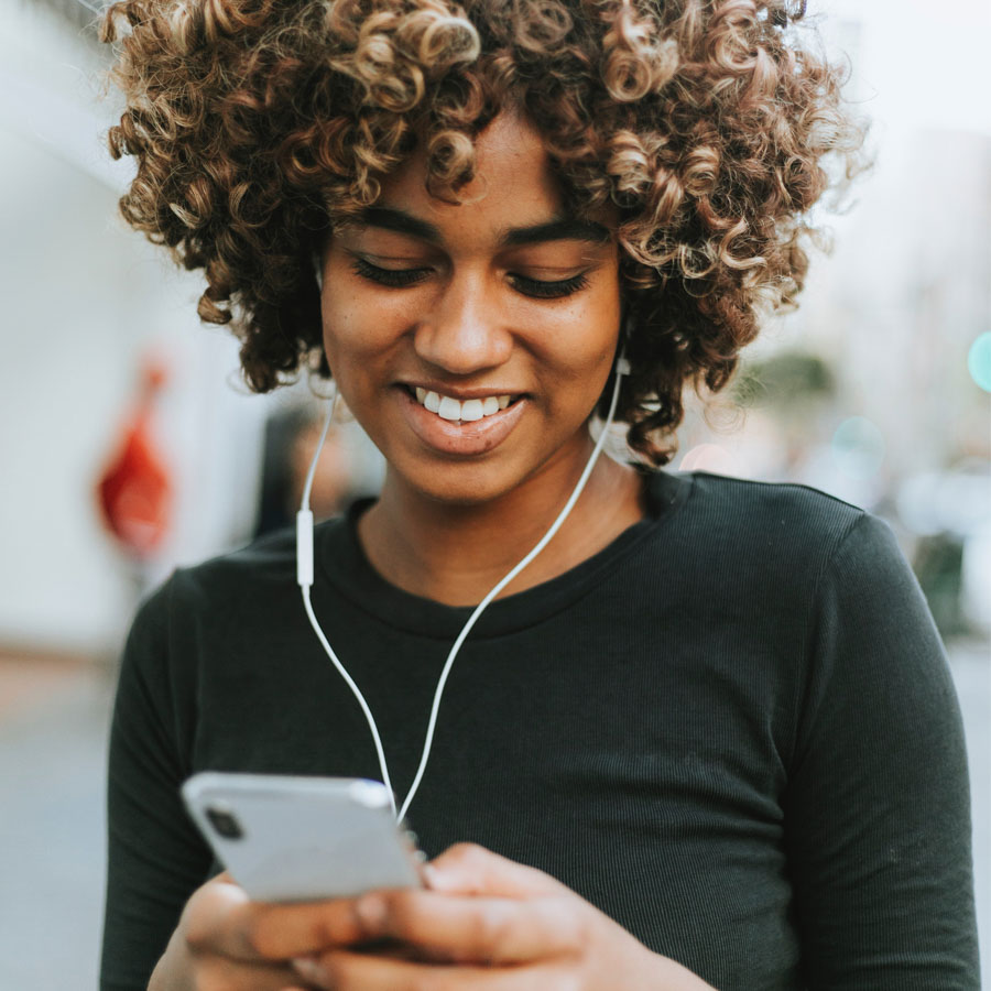 Woman listening to music with a smile