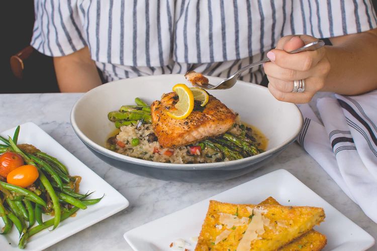 girl eating salmon healthy eating